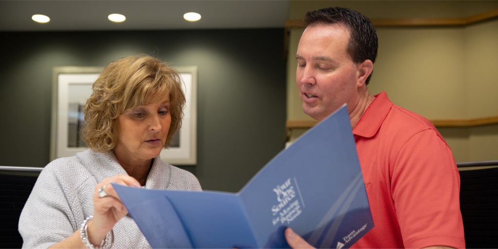 Trans Advantage employee reviewing finance options with a woman