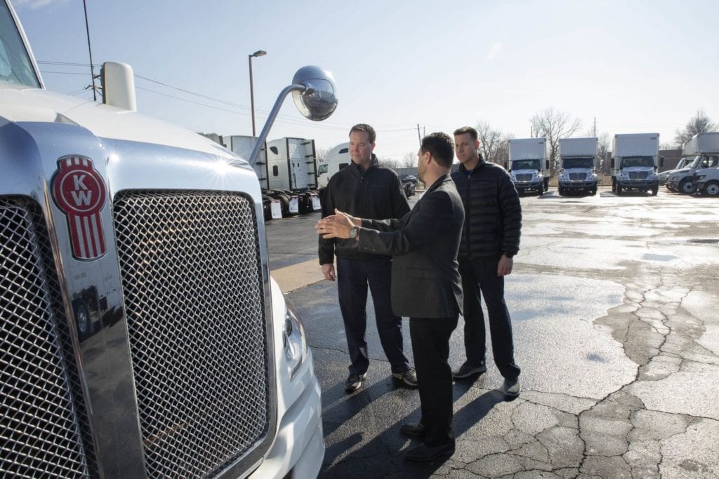 Man showing truck for sale